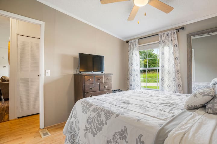 This is a Queen bed with a Roku Smart TV. All our TV's have access to local channels via antenna as well!