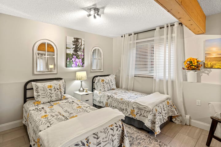 The downstairs has two new twin beds with new bedding, plus an additional living space with two love seats and a smart TV. Great for groups or families who need their own space at times! The two beds could be moved together to make a king bed.