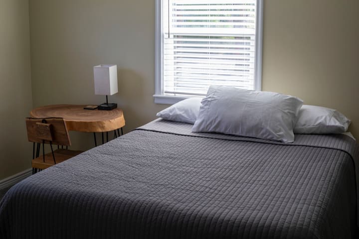 The second bedroom has a comfy memory foam mattress and is equipped with a desk and chair to make working remotely a breeze.