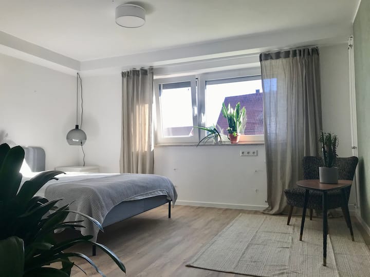 >> this room can be booked for more than 4 people 

light green bedroom downstairs with 140cm bed, large dresser and small sitting area
