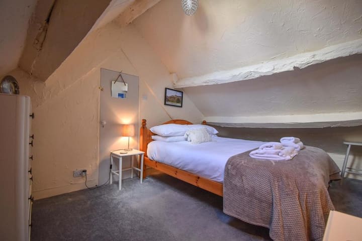Second King Sized Bedroom, on second floor. Lovely, spacious bedroom with chest of drawers and small chair.