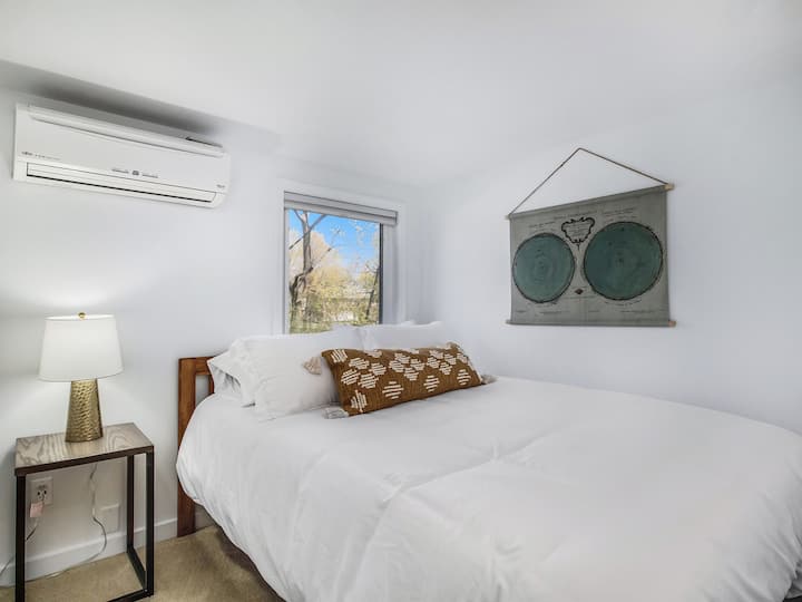 Bedroom with queen bed and its own AC unit for a great night's sleep!