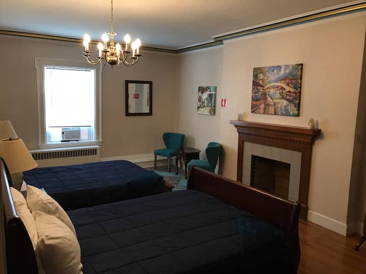 Verona has two queen beds. 
The large shared bathroom is just outside the door. The view is of our gardens. 
Air conditioner is installed. 