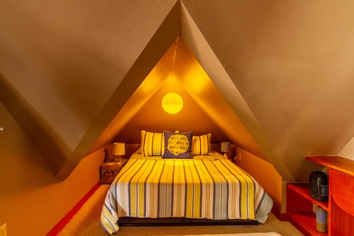 Queen size bed - I call this the "tent room".  Cozy spot for two - fun experience with a nautical elements throughout.