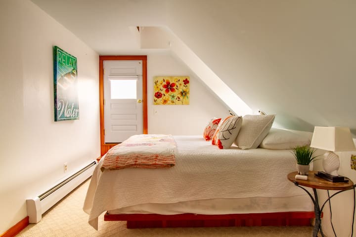Master bedroom - king size bed. Leads to deck, overlooking downtown Bristol rooftops and ocean view.