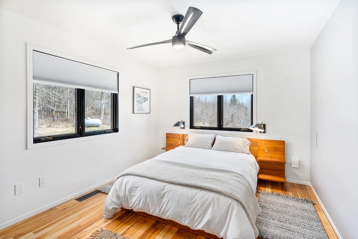 Bedroom #3, located downstairs with a dresser and closet.