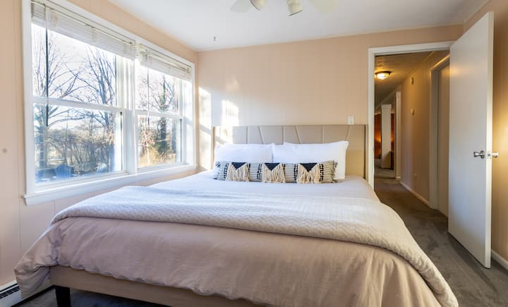 Bedroom Four - King Bed - Closet - Fan - Dresser - Chair - Garden Level