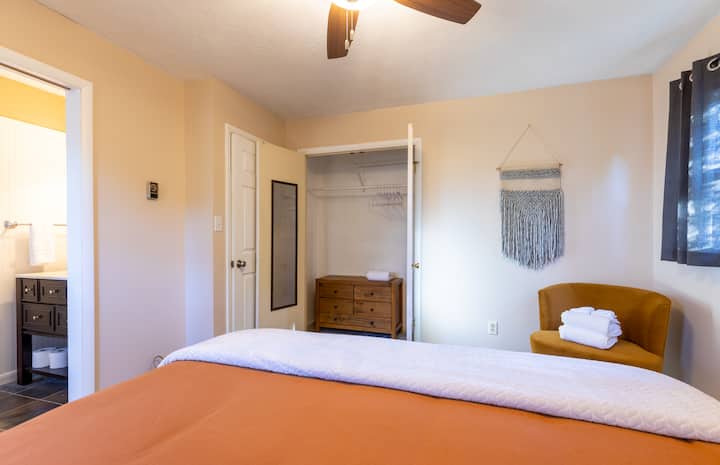 Bedroom Three - King Bed - En Suite Half Bath - Closet - Dresser - Chair - Fan - End Tables - Lamps