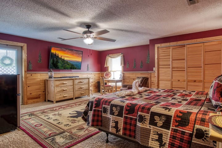 Master bedroom with huge TV and Roku TV