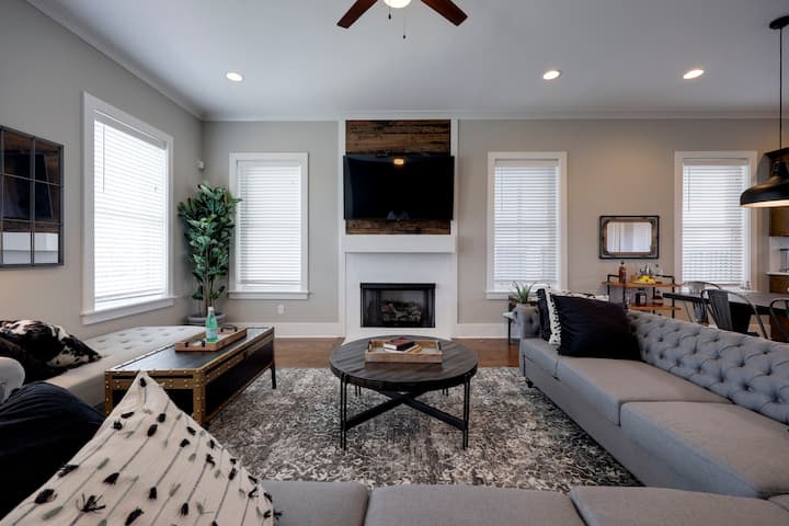 Huge open living room with comfy large couch and   flat screen TV. Pull out queen bed to the left.