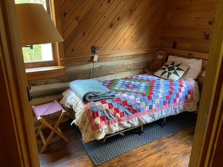 These bedroom are very small, but so charming.  This bed came from my grandfather, an old Navy man.  I have slept on it and find it quite comfy.  Probably not for a super tall person though.