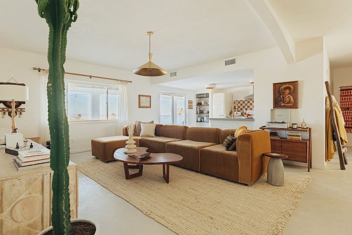 Relax in our spacious living room with Frame TV, record player, Bluetooth speaker, board games, and a luxurious Joybird sofa.
