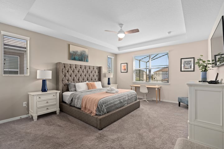 This king bedroom has a workstation and its own flat screen.