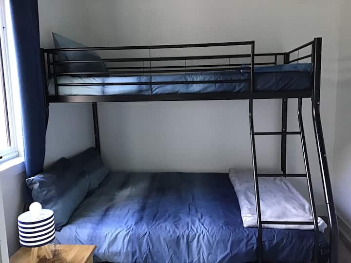 Bunk bed, single on top with double bed on the bottom.