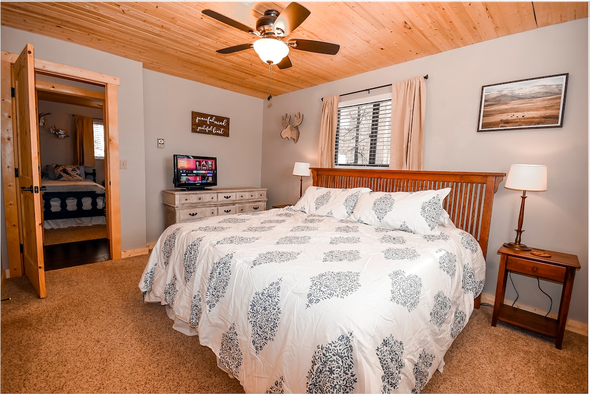 Master Bedroom: King bed with private half bath. TV with streaming available.