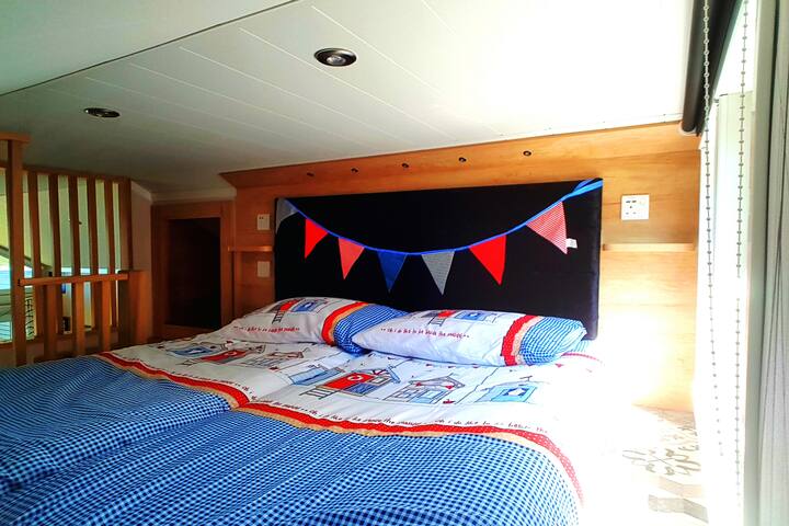 Two single beds up a ladder onto Mezzanine floor