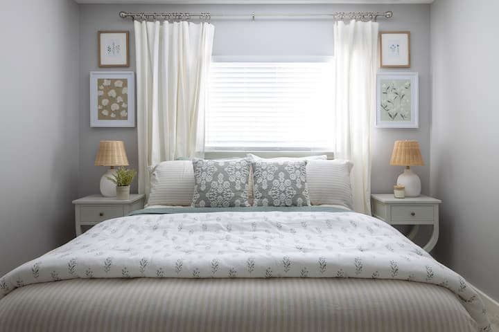 The yellow room is both cheerful and relaxing. The luxe bedding makes this bedroom super comfy. 