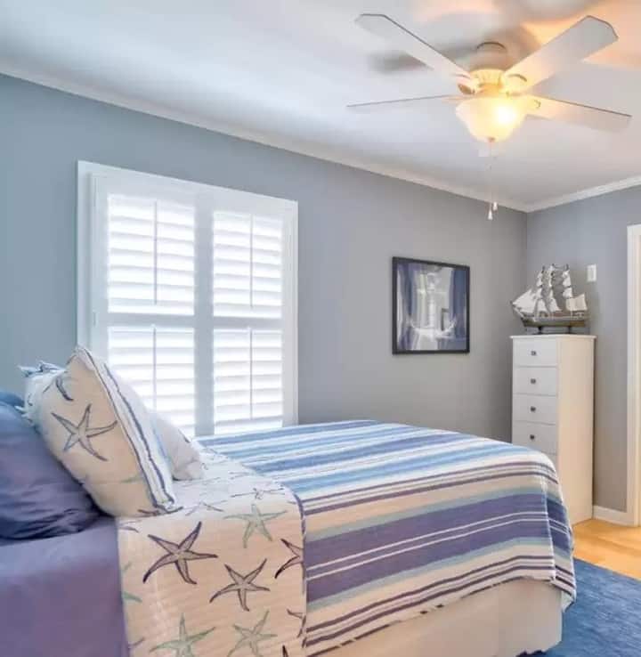 Queen size bedroom on the main level. We constantly get rave reviews about the comfort—you might find it hard to wake up for the sunrise!
