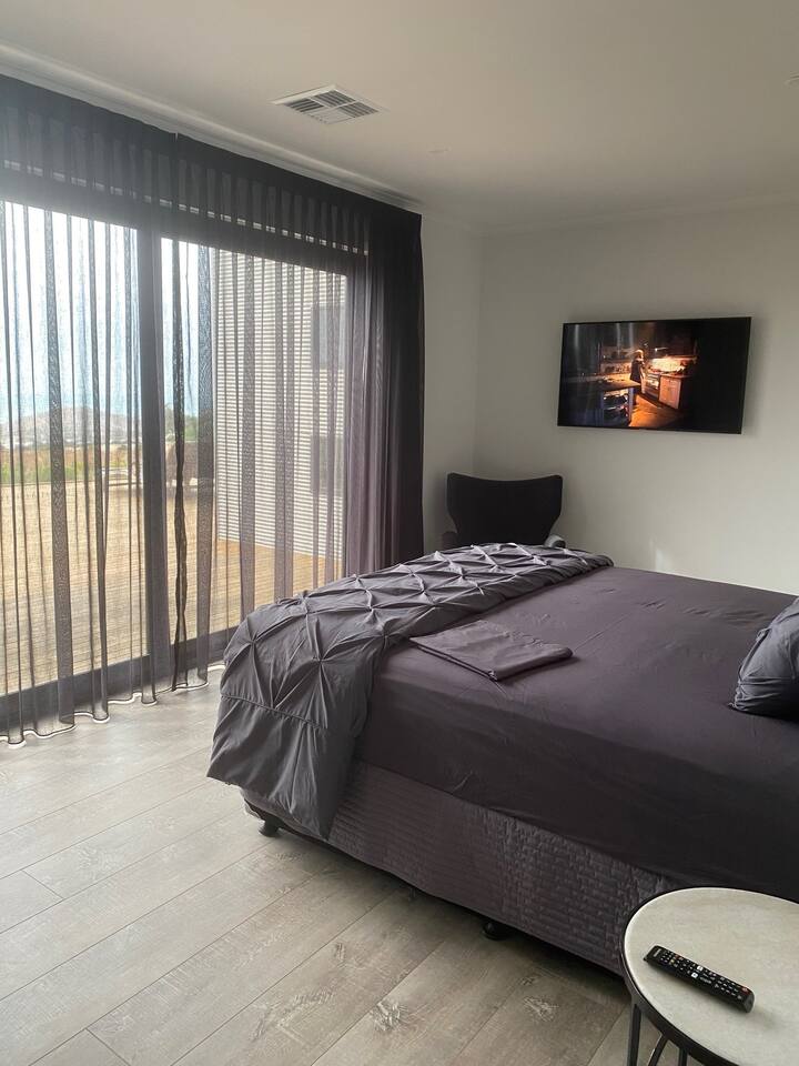 King size bedroom with TV