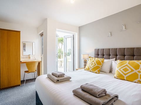 Hafdir. A coastal holiday home with hot tub.