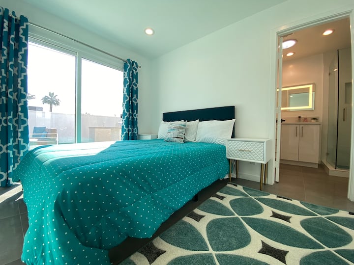 Bedroom 3, also a master suite with traditional Palm Springs views, has an ensuite shower, toilet, and vanity.