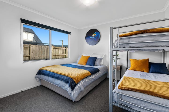 Bedroom 3 (Downstairs) - 1 Queen Bed and 2 single beds in bunk style.