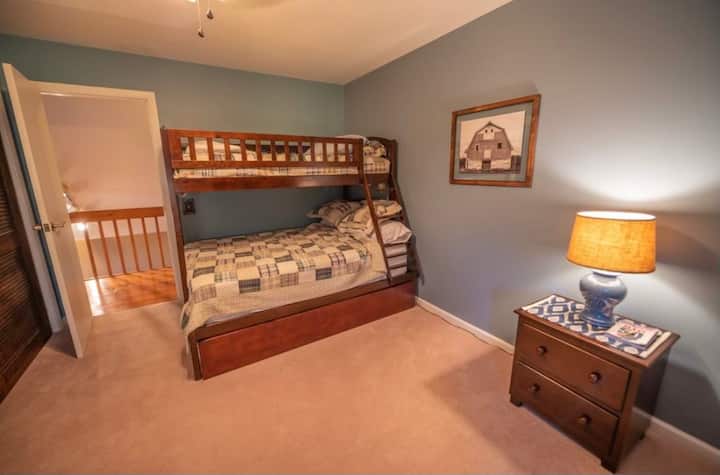 The "blue room". 2nd floor bedroom with full/twin bunk bed with additional trundle bed pull-out. Furnished with dresser, chair and closet.