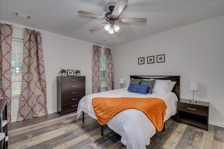 Master Bedroom includes Serta 12" gel memory foam luxury mattress and ample storage space. Both nightstand lamps are equipped with USB ports for charging electronics.

Open the blinds to enjoy a great view of the backyard.