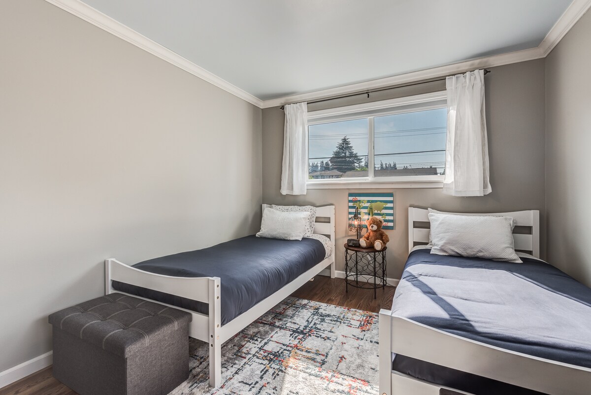 Upper bedroom with twin beds. 