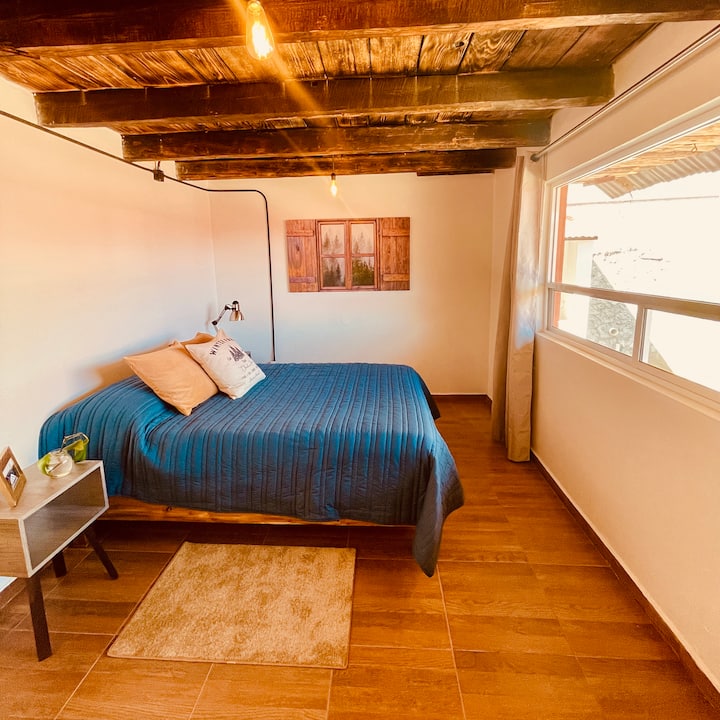 Bedroom 2 with double bed  and vanity. Overlooking the garden