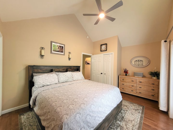 King bed with comfortable mattress and quality sheets. Headboard has lights.