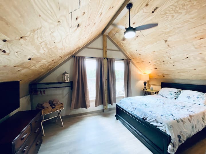 10x16 open-air, Master Loft offers Great Views, Queen Size Bed, TV, Luggage rack, dresser, and place to hang clothes. 