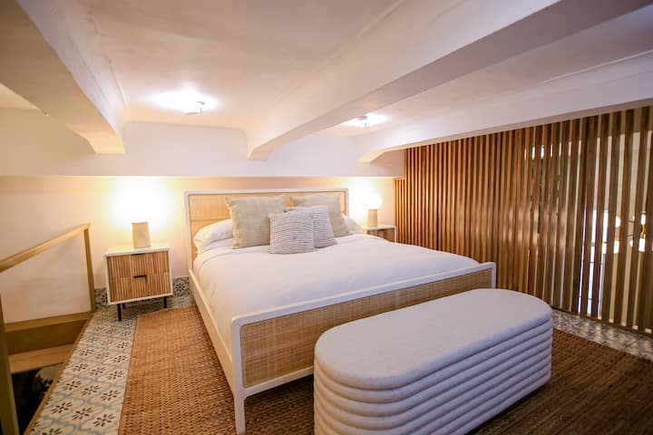 Loft bedroom overlooking the living area