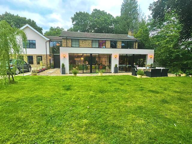 Lovely large modern home in private wooded estate gallery image 2