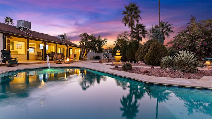 H2O Sanctuary pool and house exterior at dusk