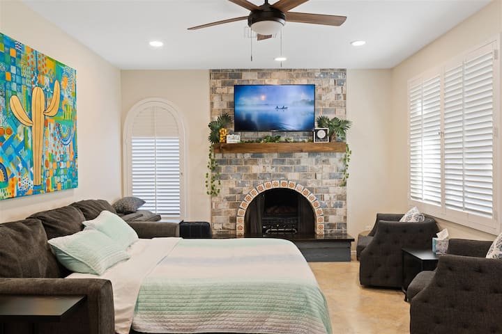 H2O Sanctuary master bedroom with stone fireplace