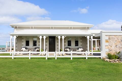 Historic Harbour Masters House right on the beach