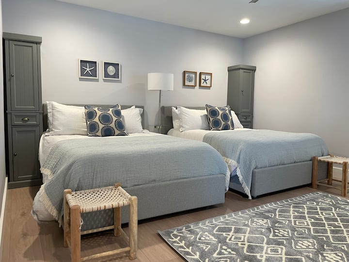 Second bedroom -- two full beds with storage. 