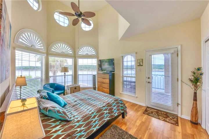 Lakeview's galore from every window.  You'll enjoy waking up to this view!  The bedroom has a soaring two story ceiling.  