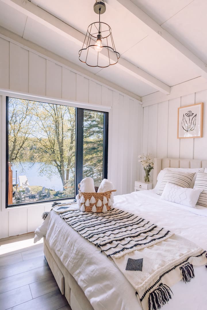 Master 2 of 2 - Lakefront Bedroom with Queen Bed, that includes WFH nook and views.