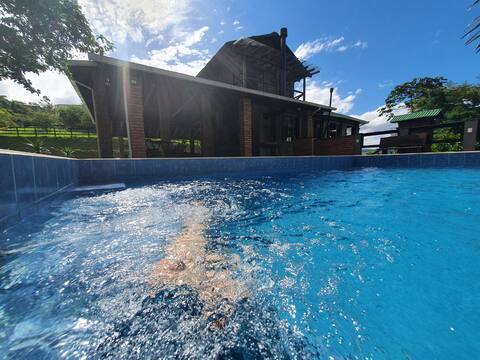 Family Chalet: bathtub, pool, central area.