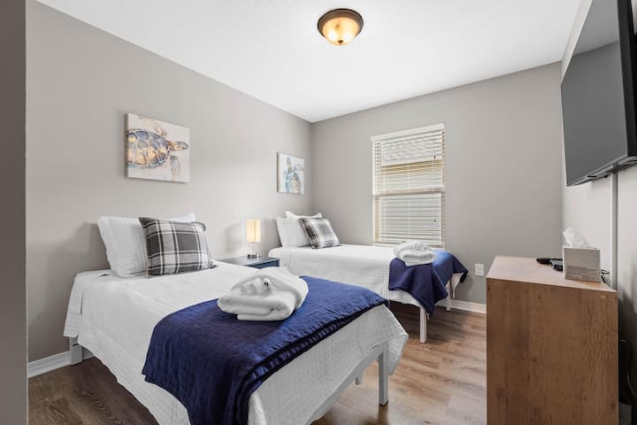 Guest Room 3 with two twin beds, 50" smart TV,  cable TV, and closet