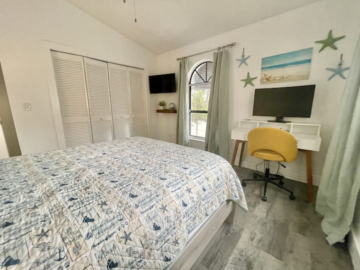 Guest Bedroom #1 features a dedicated workspace - connect your laptop to the onsite widescreen monitor (keyboard and mouse not provided). 