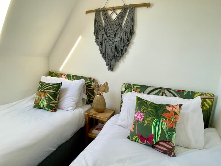 Bedroom 2 - Twin Room. Designed so all ages will appreciate the jungle  theme. The macrame was handmade by us.