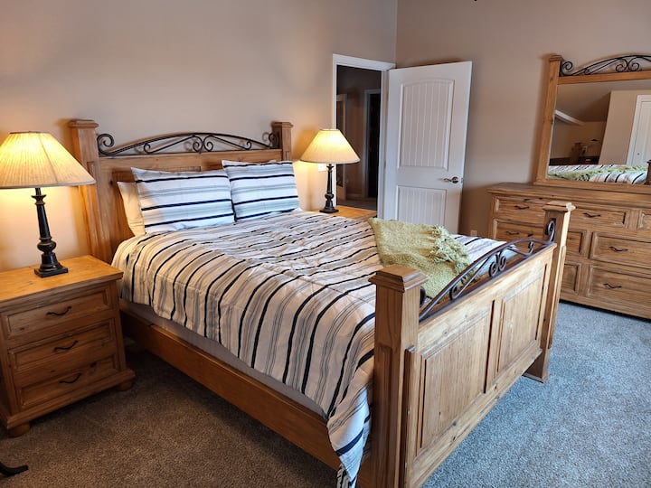 Upstairs queen bedroom with desk area