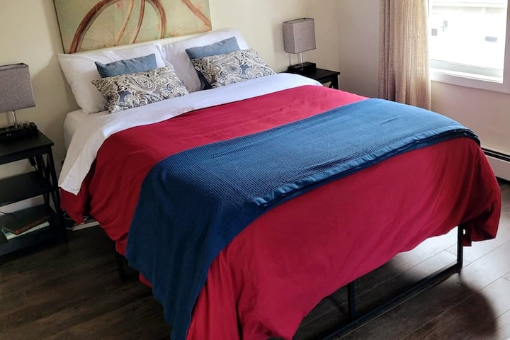 Bedroom #1. Full-sized bed.  Touch lamps with USB ports, alarm clock with USB ports, closet, extra sheets/blankets, and hamper. 