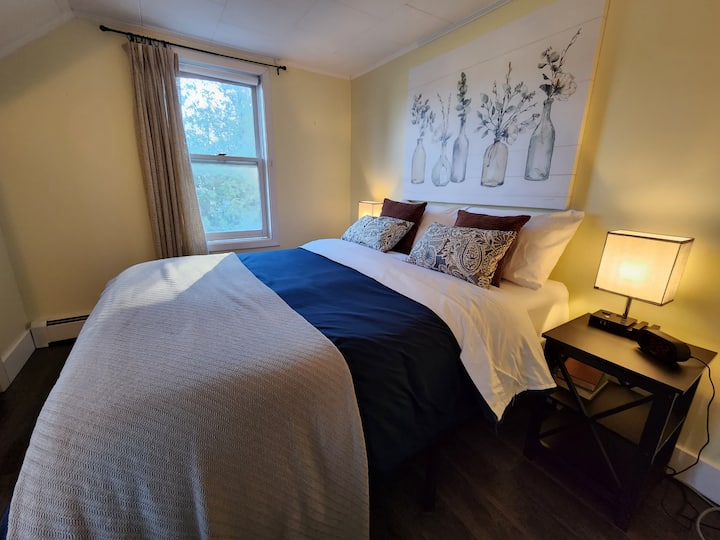 Bedroom #3. Full bed, touch lamps, usb ports, extra bedding, extra pillows, extra sheets, hamper, closet, and fan.