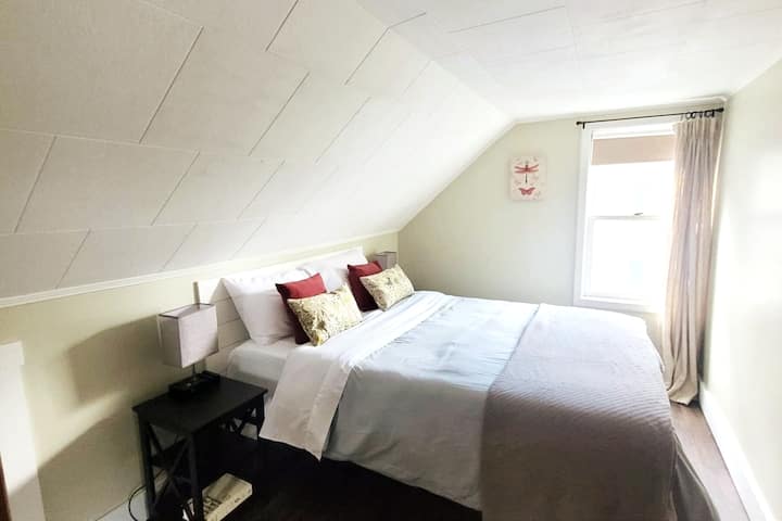 Bedroom #2. Queen-sized bed. Touch lamps with USB ports, alarm clock with USB ports, closet, extra sheets/blankets, and hamper.