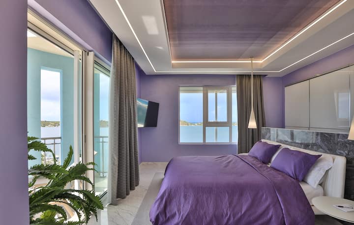 Upon entering the Harmony Room, the 55" smart television is directly facing you. There is a nightstand at each bedside. 