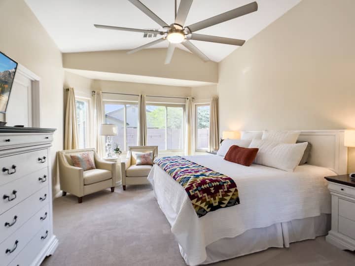 Spacious master bedroom with bay window and reading chairs that overlooks the backyard pool area! 